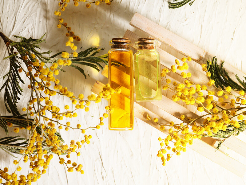 essential oils and yellow flowers