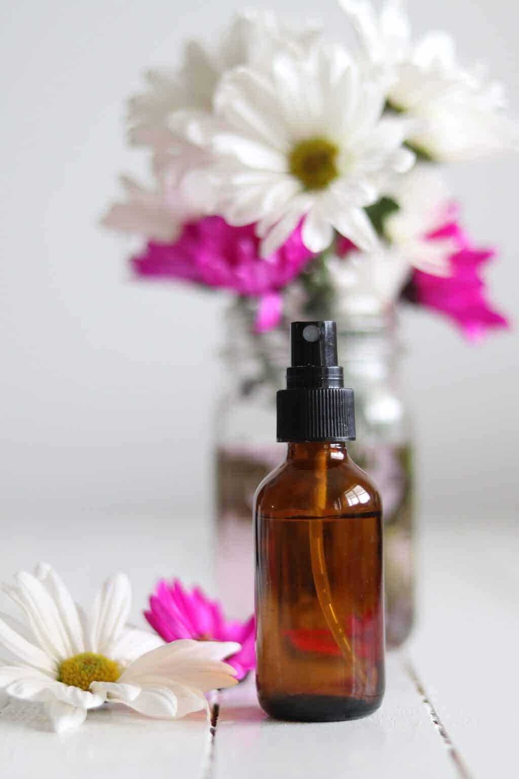 bottle with flowers and essential oils