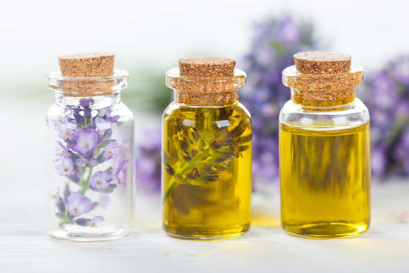 essential oil bottles with flowers